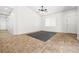Bright living area featuring tile flooring, modern ceiling fan, and access to other rooms at 1440 Summer Glow Ave, Henderson, NV 89012