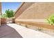 Side yard of a home with desert landscaping, a walkway, and a gated entrance at 1440 Summer Glow Ave, Henderson, NV 89012
