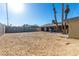 This large backyard features a colorful wall and space for outdoor entertaining at 1727 Cherokee Ln, Las Vegas, NV 89169