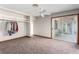 Bedroom with patio access, closet organizer, and neutral carpet flooring at 1727 Cherokee Ln, Las Vegas, NV 89169