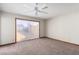 Bedroom with a sliding door to a patio and a ceiling fan at 1727 Cherokee Ln, Las Vegas, NV 89169