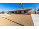 Charming single story home featuring well-maintained landscaping, attractive desert rock, and a two-car garage at 1727 Cherokee Ln, Las Vegas, NV 89169