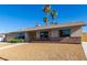 Charming single story home featuring well-maintained landscaping, attractive desert rock, and unique security door at 1727 Cherokee Ln, Las Vegas, NV 89169