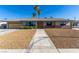 Charming single story home featuring well-maintained landscaping, and attractive desert rock at 1727 Cherokee Ln, Las Vegas, NV 89169