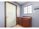 Functional laundry area featuring storage cabinets and neutral walls at 1727 Cherokee Ln, Las Vegas, NV 89169