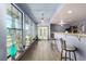 Bright living room features large windows, plants, wood floors and breakfast bar at 1727 Cherokee Ln, Las Vegas, NV 89169