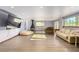 Spacious living room featuring recessed lighting, a fireplace, laminate wood floors, and large windows at 1727 Cherokee Ln, Las Vegas, NV 89169
