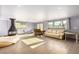 Spacious living room featuring recessed lighting, a fireplace, laminate wood floors, and large windows at 1727 Cherokee Ln, Las Vegas, NV 89169