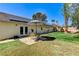 Spacious backyard featuring a patio with seating and lush green grass, perfect for outdoor gatherings and relaxation at 1940 Canterbury Dr, Las Vegas, NV 89119