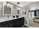 Bathroom with double vanity, designer faucets, and modern lighting fixtures at 1940 Canterbury Dr, Las Vegas, NV 89119