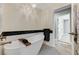 Modern soaking tub and brass fixtures in updated bathroom at 1940 Canterbury Dr, Las Vegas, NV 89119