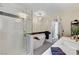 Bright bathroom featuring a shower, modern tub, and double sinks at 1940 Canterbury Dr, Las Vegas, NV 89119