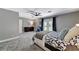 Spacious and bright bedroom featuring a large bed and a comfortable seating area at 1940 Canterbury Dr, Las Vegas, NV 89119