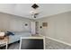 Bedroom with plush carpet, ceiling fan, twin bed and open door at 1940 Canterbury Dr, Las Vegas, NV 89119