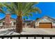 Charming single-story home featuring a well-maintained yard, brick accents, and a prominent palm tree at 1940 Canterbury Dr, Las Vegas, NV 89119