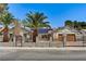 Inviting home with palm trees and brick accents at 1940 Canterbury Dr, Las Vegas, NV 89119