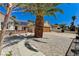 Charming home featuring mature palm trees and gravel landscaping at 1940 Canterbury Dr, Las Vegas, NV 89119