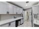 Bright laundry room with ample counter space, overhead cabinets, and convenient access to the home at 1940 Canterbury Dr, Las Vegas, NV 89119