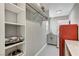 Practical laundry room offering shelving, a sink, and updated appliances for convenience at 1940 Canterbury Dr, Las Vegas, NV 89119