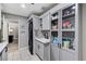 Functional laundry space with a sink, modern appliances, and storage for household supplies at 1940 Canterbury Dr, Las Vegas, NV 89119