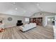 Bright and airy living room with wood flooring, built-in bookshelves, and vaulted ceiling at 1940 Canterbury Dr, Las Vegas, NV 89119