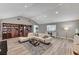 Spacious living room with wood floors, vaulted ceilings, built-in bookcases, and lots of natural light at 1940 Canterbury Dr, Las Vegas, NV 89119