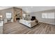Bright living room featuring a brick fireplace, wood floors, and vaulted ceilings at 1940 Canterbury Dr, Las Vegas, NV 89119