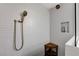 Modern shower with textured tile, bronze fixtures, and convenient corner shelf at 1940 Canterbury Dr, Las Vegas, NV 89119