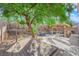 Expansive backyard featuring a wood deck, lounge furniture, outdoor kitchen, pool and waterfall at 204 Appian Way, Henderson, NV 89002
