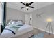 Bright bedroom featuring a ceiling fan, a window, and stylish decor at 204 Appian Way, Henderson, NV 89002