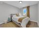 Cozy bedroom with neutral colors, a window, and a bedside table at 204 Appian Way, Henderson, NV 89002
