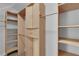 Open-concept closet features multiple shelves and a cabinet at 204 Appian Way, Henderson, NV 89002