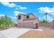 Two-story home featuring a three-car garage, desert landscaping, and neutral color palette at 204 Appian Way, Henderson, NV 89002