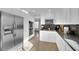 Bright kitchen featuring white cabinets, stainless steel appliances, and dark granite countertops at 204 Appian Way, Henderson, NV 89002