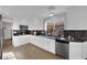 Bright kitchen features white cabinets, granite countertops, and stainless steel appliances at 204 Appian Way, Henderson, NV 89002