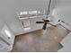 High angle view of living room, featuring tile floors, entry door, high ceilings, and fan at 204 Appian Way, Henderson, NV 89002