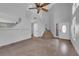 Bright living room with high ceilings, tile floors, staircase, and entry door at 204 Appian Way, Henderson, NV 89002