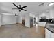 Open concept living room adjacent to the spacious kitchen and fireplace at 204 Appian Way, Henderson, NV 89002