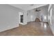 Inviting living room with soaring ceilings, staircase, and sleek, modern kitchen appliances at 204 Appian Way, Henderson, NV 89002