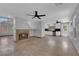 Spacious living room with neutral walls and tile flooring and fireplace at 204 Appian Way, Henderson, NV 89002