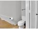 A bright, neutral powder room features a toilet and modern fixtures at 204 Appian Way, Henderson, NV 89002