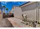 Low maintenance backyard with gravel, stone pavers, and convenient pool equipment at 2078 Wildwood Lake St, Henderson, NV 89052