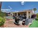 Backyard with a pool, covered patio, grill, and desert landscaping at 2078 Wildwood Lake St, Henderson, NV 89052