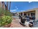 Backyard view with pool, covered patio, grill, and inviting outdoor space at 2078 Wildwood Lake St, Henderson, NV 89052