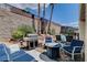 Backyard featuring a pool, patio, grill, fire pit, and mature landscaping at 2078 Wildwood Lake St, Henderson, NV 89052