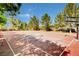 Outdoor basketball court surrounded by mature trees for a shaded recreational area at 2078 Wildwood Lake St, Henderson, NV 89052