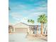 Charming single-story home featuring desert landscaping and a two-car garage at 2078 Wildwood Lake St, Henderson, NV 89052