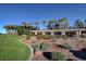 Expansive green space with mature trees and bushes with walking paths enhancing the natural beauty at 2078 Wildwood Lake St, Henderson, NV 89052