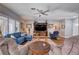 Comfortable living room with plush seating, wood accents, and ample natural light at 2078 Wildwood Lake St, Henderson, NV 89052