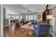 Spacious living room boasts hardwood floors and ample natural light with views of the kitchen at 2078 Wildwood Lake St, Henderson, NV 89052